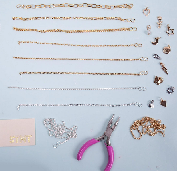 Different chains and charms included in the Infinity Jewelry Kit. 
