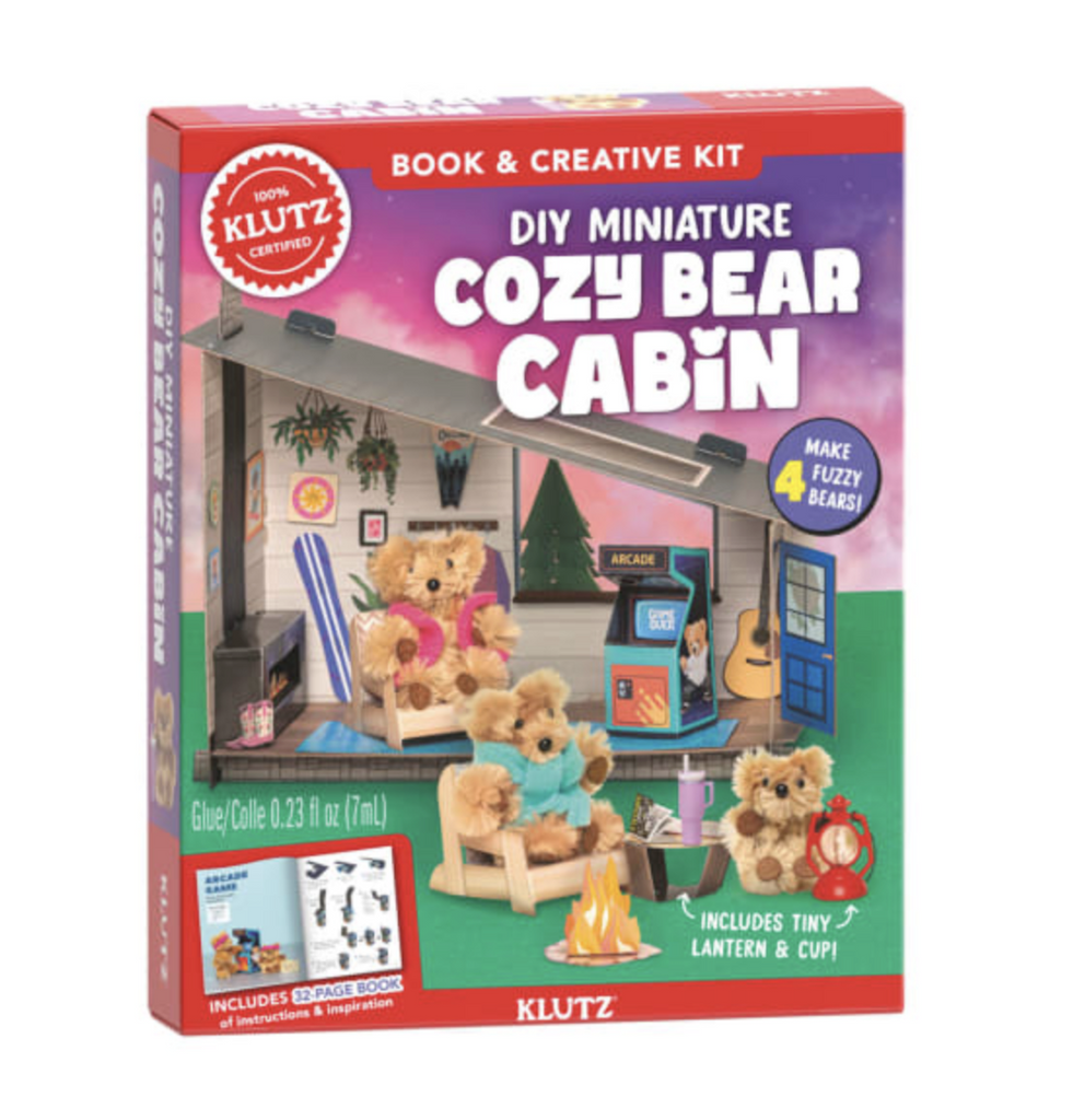Red box with a picture of the DIY Cozy Bear Cabin constructed with three fuzzy bears posed throughout the cabin. 