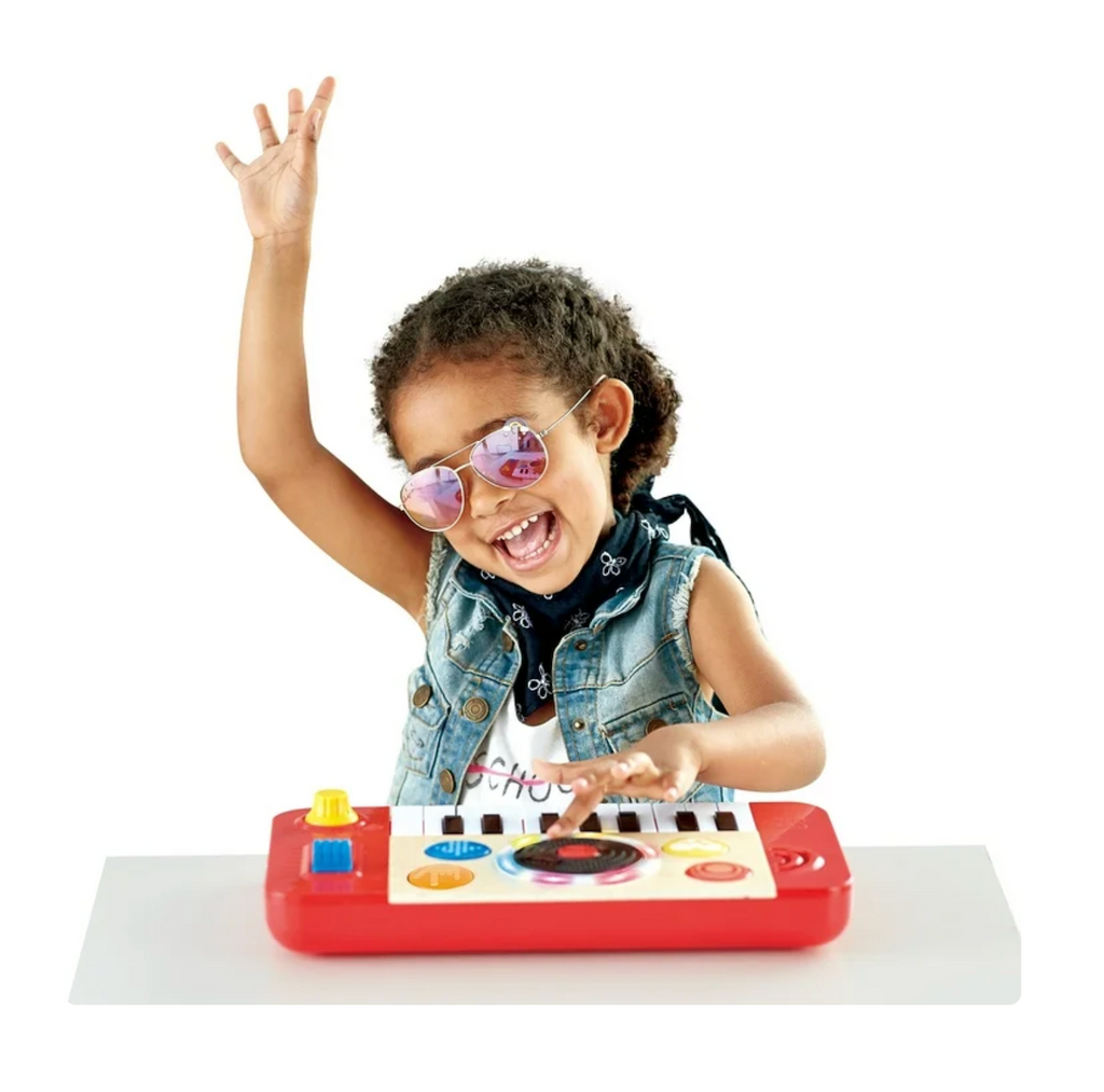 A kids having a great time mixing it up with the DJ Mix and Spin piano toy. 