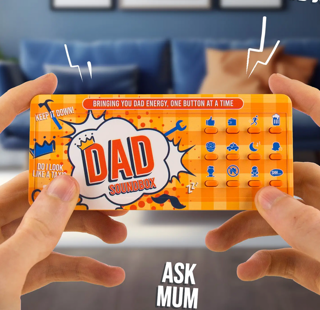 The Dad Soundbox being held in a pair of hands, the top of the box read "bringing you Dad energy, one button at a time" 
