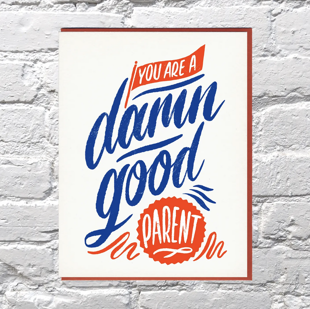 Greeting card that reads "You Are A Damn Good Parent" in red, white and blue lettering, especially for non binary parents. 