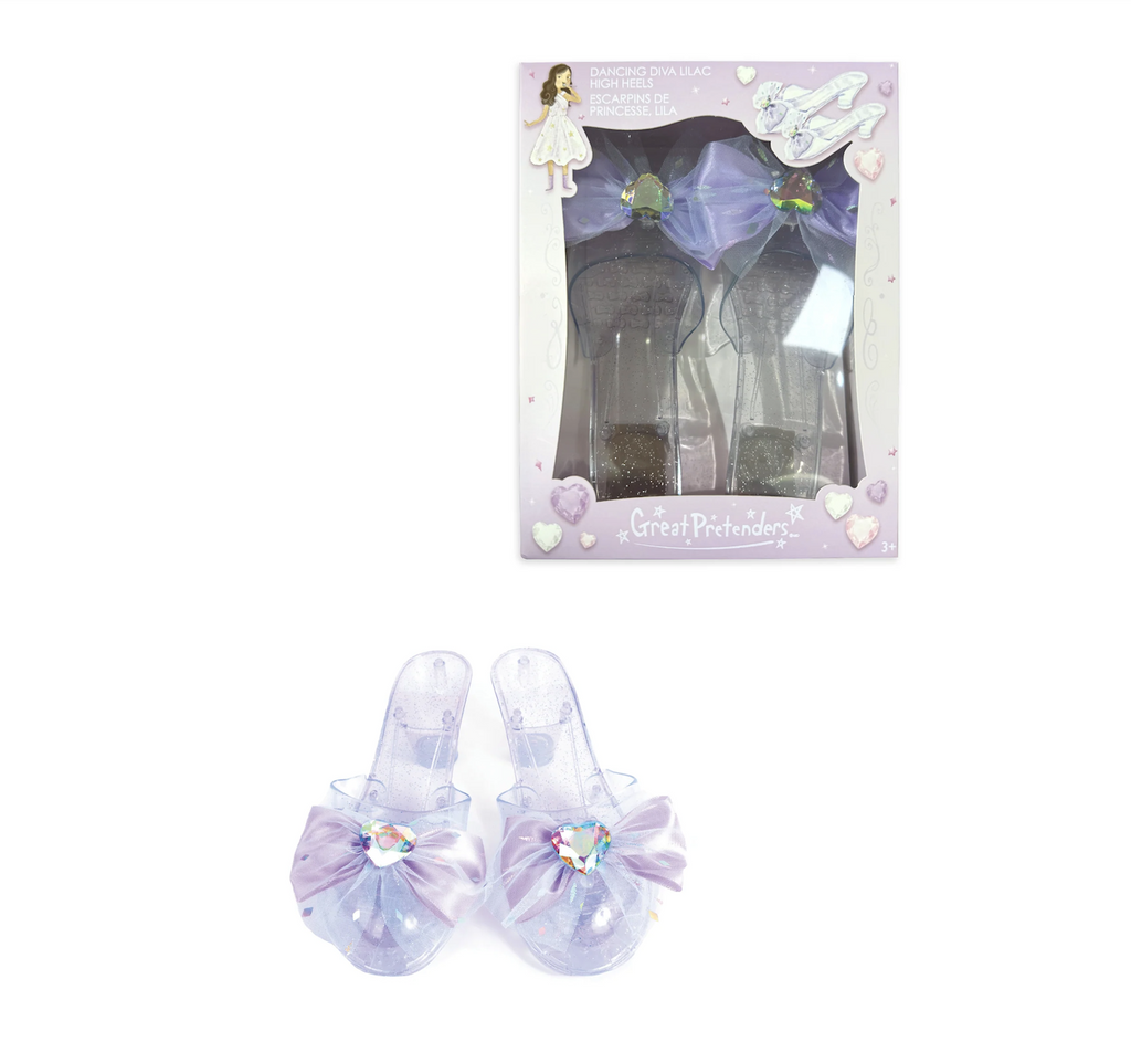 Childrens dress up high heels, clear shoes with glitter and on  top, a bright lilac bow with an iridescent heart-shaped jewel for extra sparkle and shine. Packaged in a box with a clear top so the shoes can be viewed. 