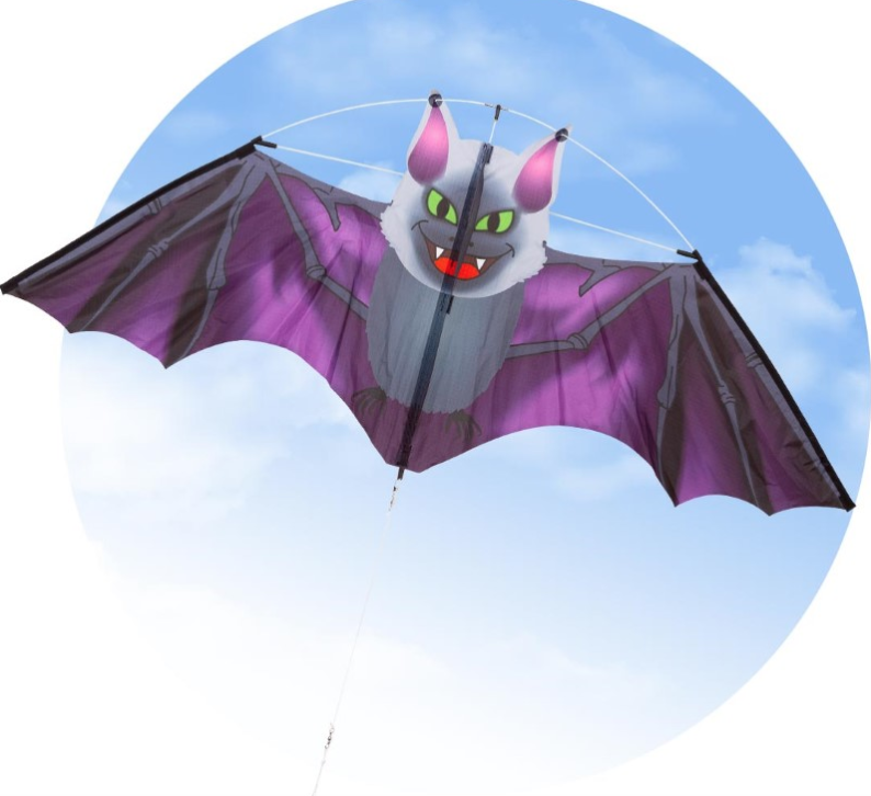 The Dark Fang Bat Kite flying in the air. It's wings are dark purple and has green eyes with it's fangs out. 