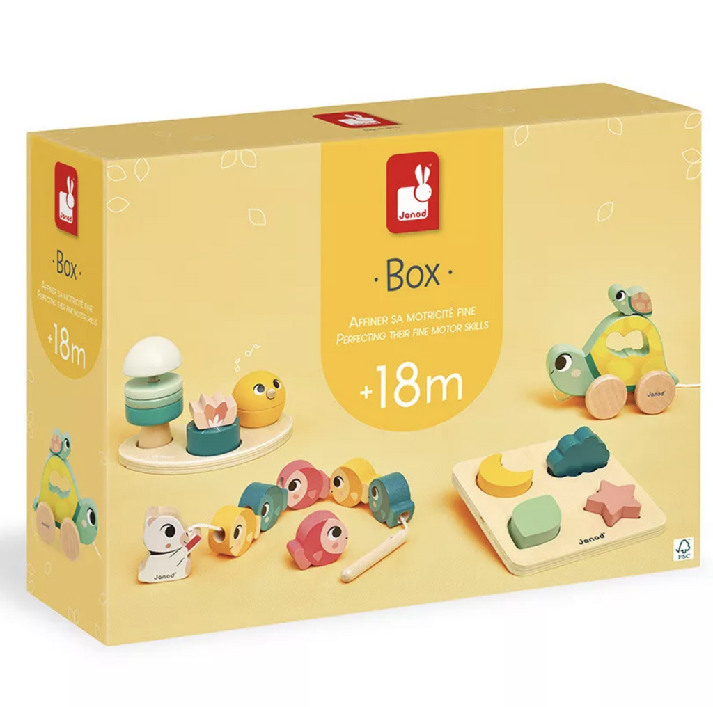 Bright yellow box with pictures of each of the four toys in the Toy Box by Janod