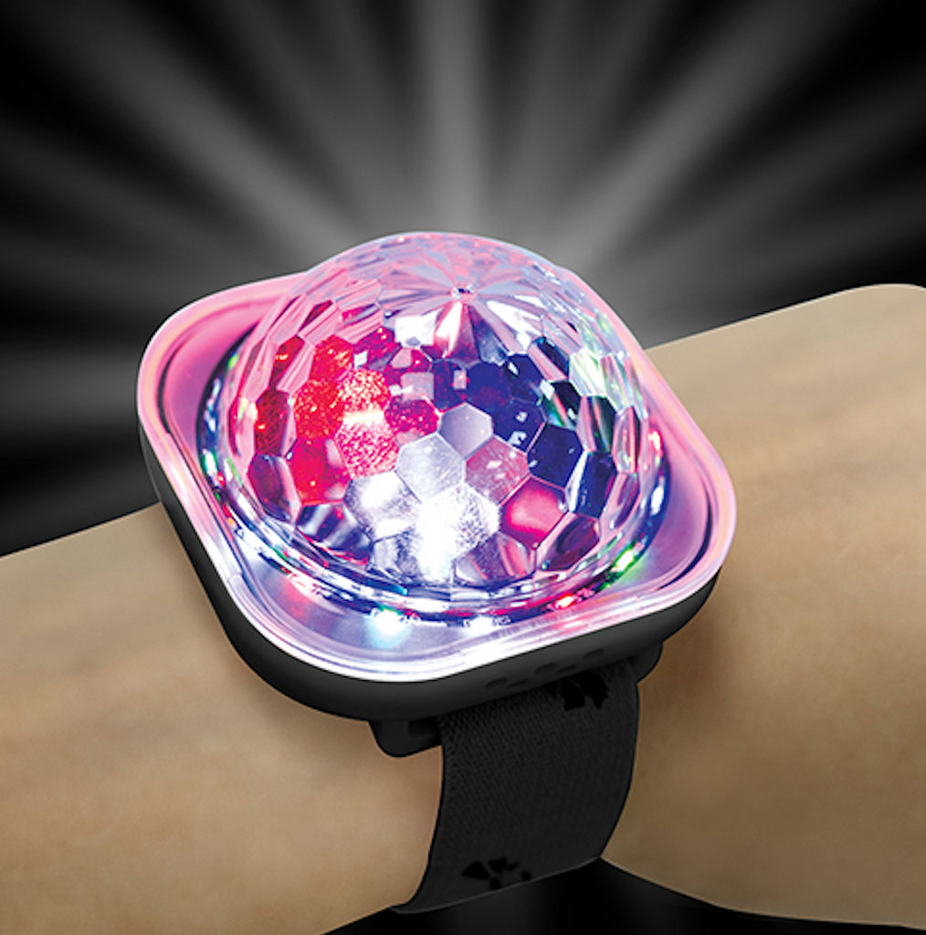 Close up of the Disco Ball Wristband on a wrist and the multicolored lights shining bright.