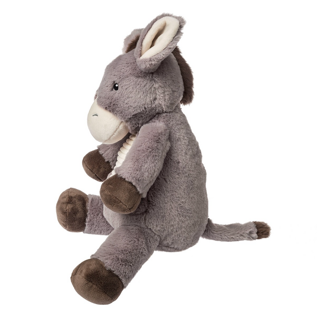 Side view of Dusty Donkey, this view shows his long tail and mane of brown. 