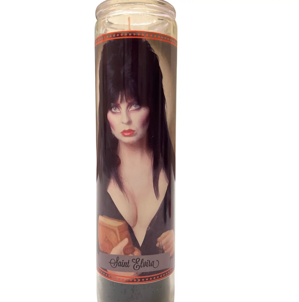 7 Day altar candle with black wax that has a photo of Elvira Mistress of the Dark on the front. 