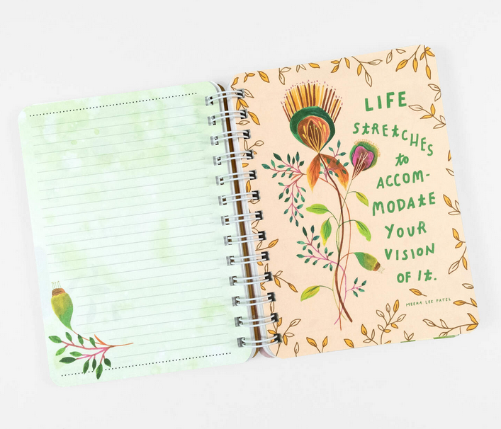 Interior page of planner with blank lined page and a flower illustration that reads " Life stretches to accomodate your vision of it" 