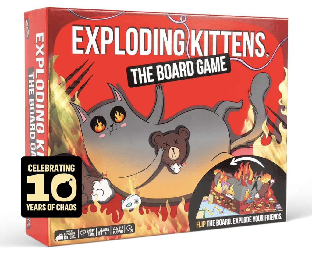 The cover of the box for Exploding Kittens The Board Game. An illustrated image of a gray cat laying on it's side with flames in it's eyes and all around it. The cat is holding the head of a stuffed bear. In the bottom right corner there is a picture of the 3d game board set up for play. 