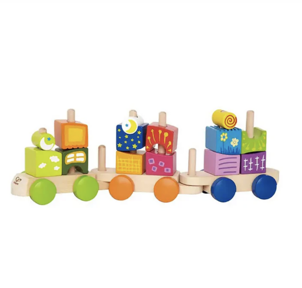 Close up picture of the Fantasia Blocks Train, a set of colorful blocks in different shapes that fit on a series of wooden cars that link together to  form a train. 