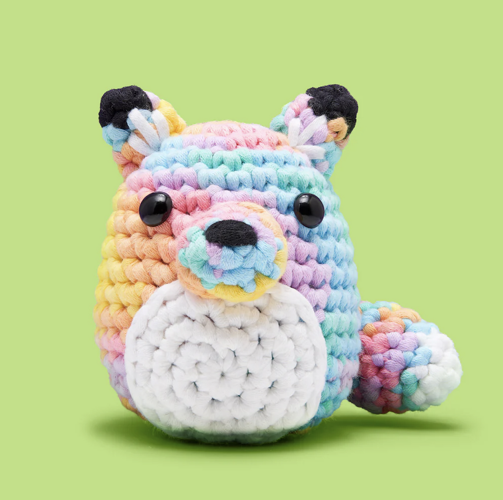 Crocheted Felix Fox stuffed animal in pretty pastel colors. 