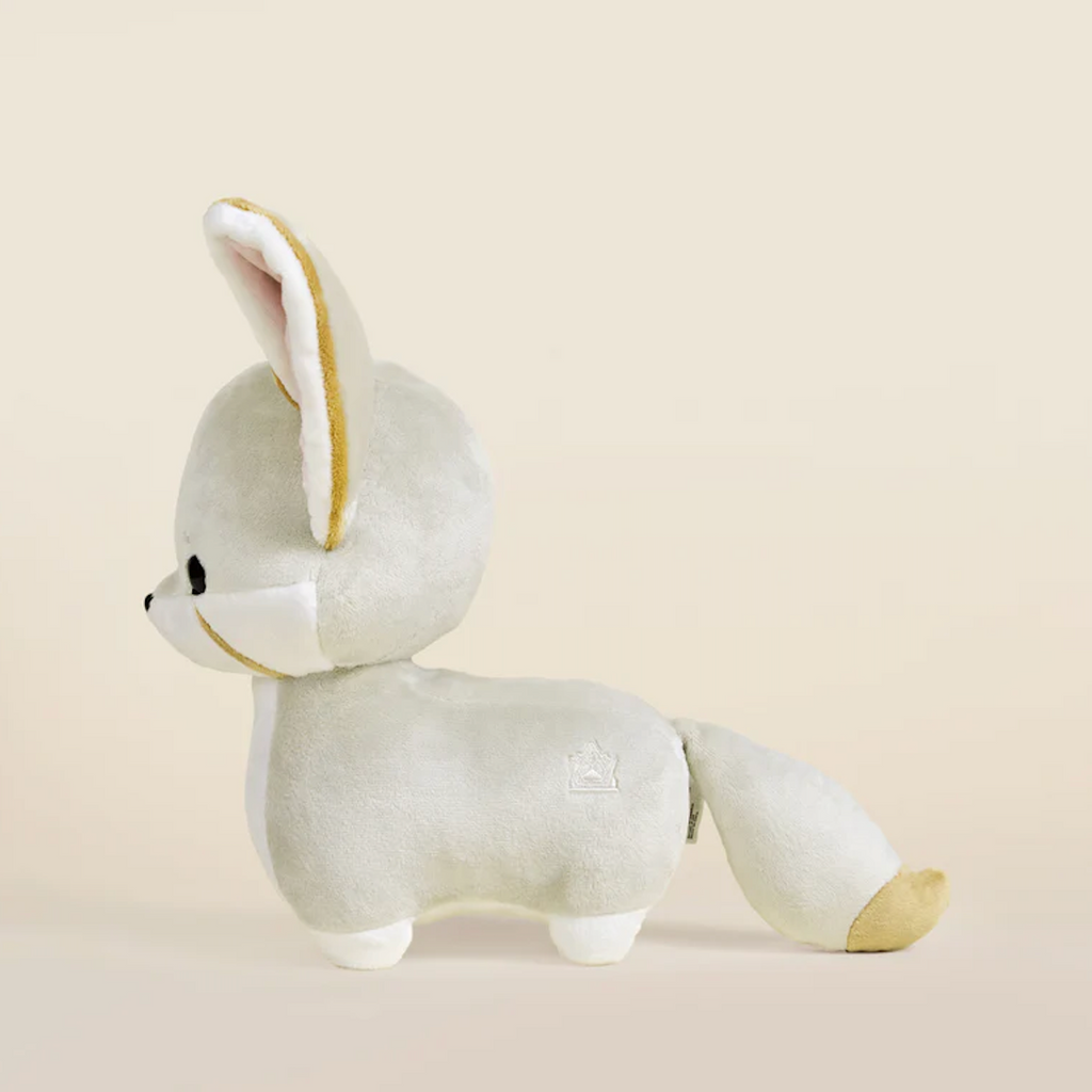 Fenni the Fox pictured from the side showing it's fluffy tail tipped with gold 