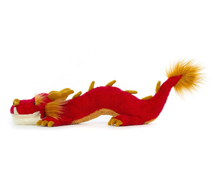 Side view of the Festival Dragon. His long red body with gold spikes on his back and tufty ears and tail. 