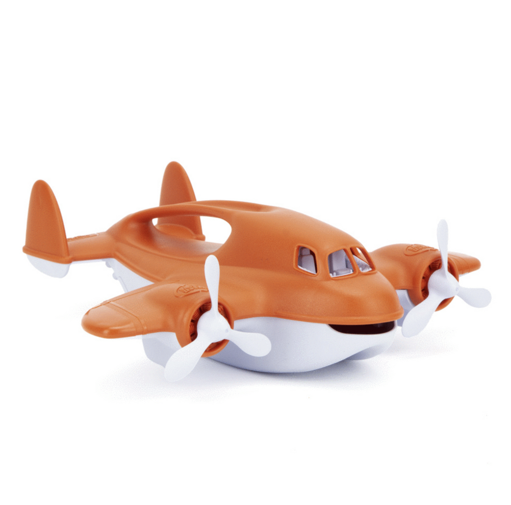 Orange plane with white undercarriage that has two propellers on each wing and a handle at the top. 