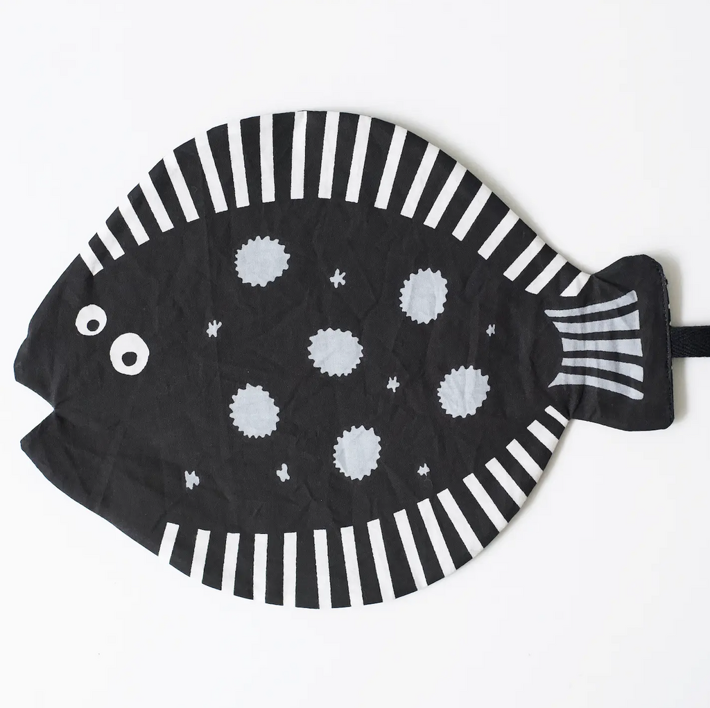 Fish Crinkle Toy a flat crinkle fabric with an illustration of a fish in white on a black background for high contrast. 