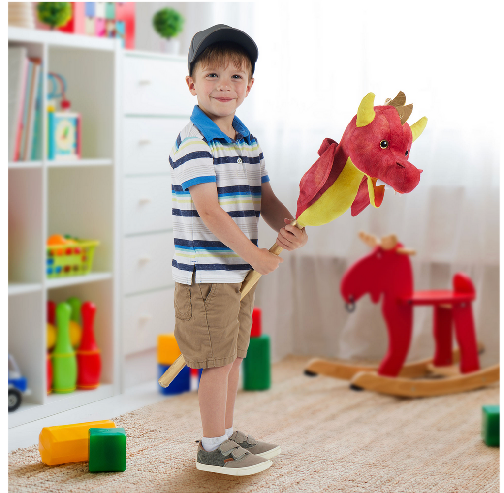 Child in a playroom riding the Flaming Dragon ride on hobby horse style toy.