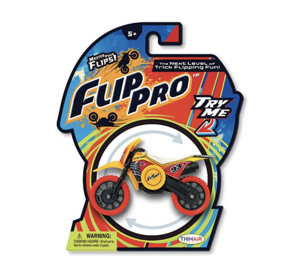 A red and yellow Flip Pro Spin Bike packaged on a colorful hang card. Clear plastic covers the Spin Bike with a hole in the center so t he Spin Bike can be tested out. 
