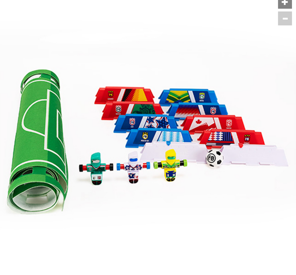 A soccer-themed toy set, featuring a rolled fet green field mat, multiple colorful flag-shaped stadium barrier pieces, three international themed Foosbots, and a soccer ball.