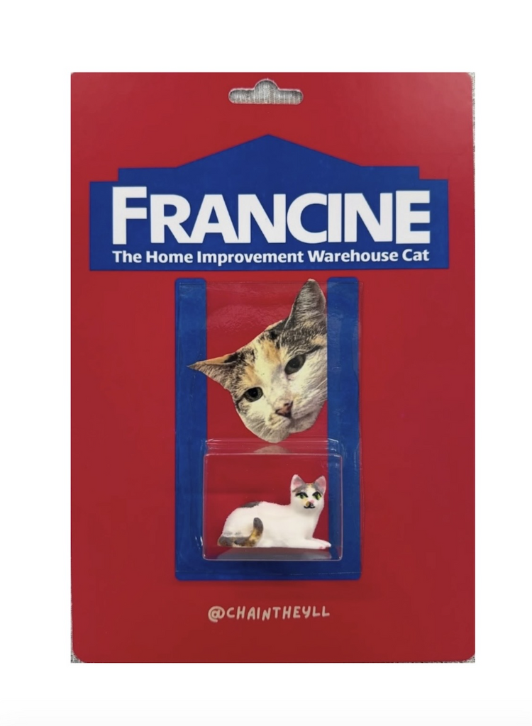 Red and blue hand painted card with Francine the Lowe's cat packaged on the front. 
