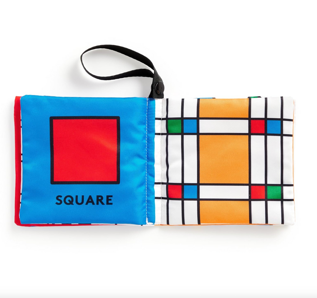 Interior pages from the Frank Lloyd Wright My First Shapes Crinkle Stroller Book featuring a bright red square on a blue fabric page, and small green, red, and blue squares on a yellow, white and black lined background. 