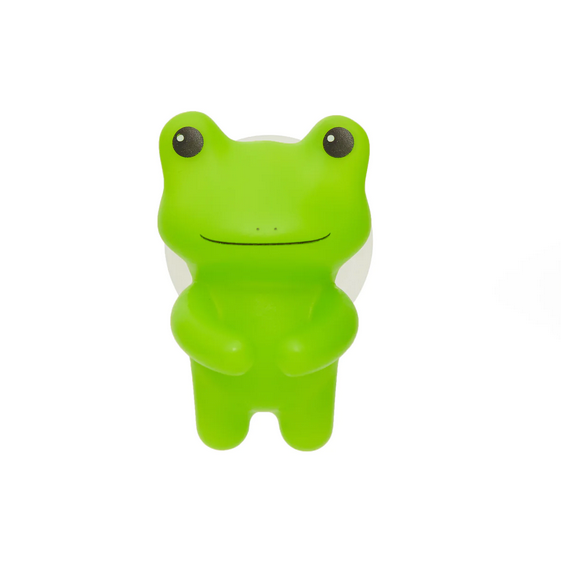 Close up of green silicone frog toothbrush holder with black eyes and smiling face. 