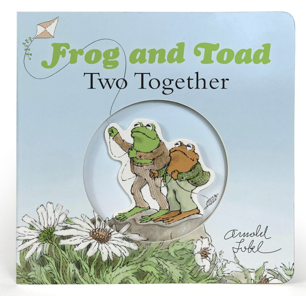 Cover of the Frog and Toad Two Together board book with an illustration of Frog and Toad  in a field of flowers flying a kite. 
