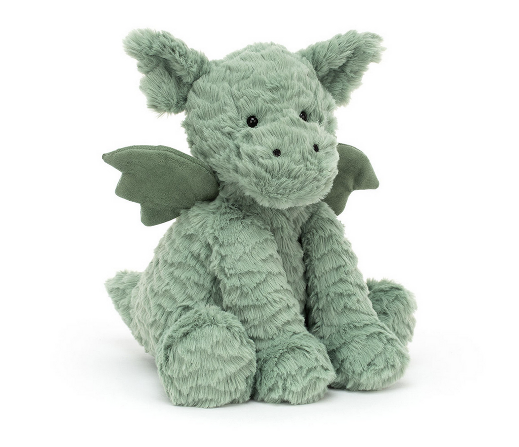 Winged green plush dragon on a white background