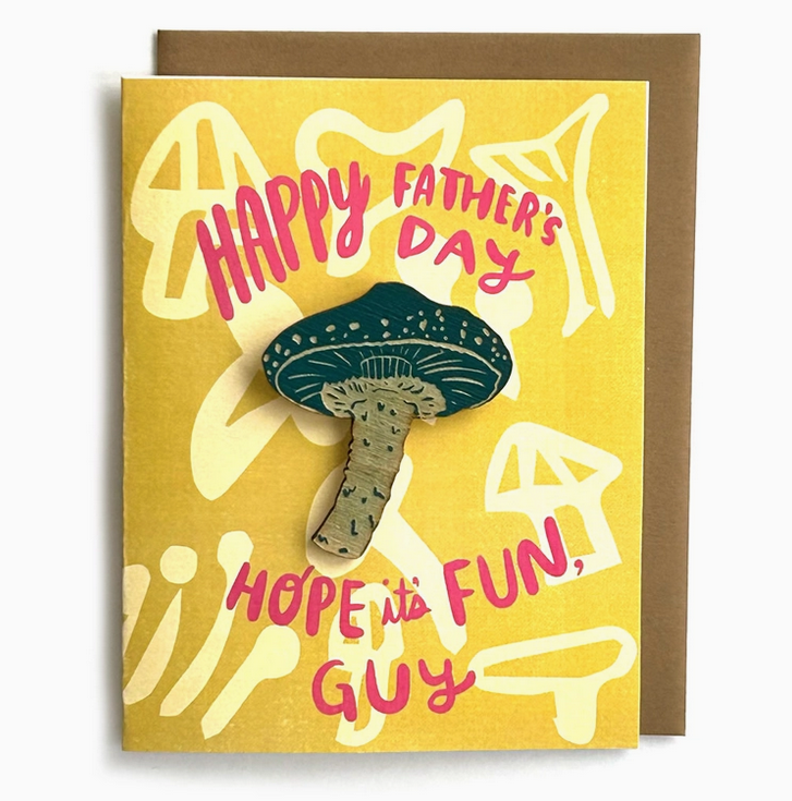 Greeting card with wooden mushroom magnet attached to a yellow card that reads "Happy Father's Day, Hope it's Fun, Guy"