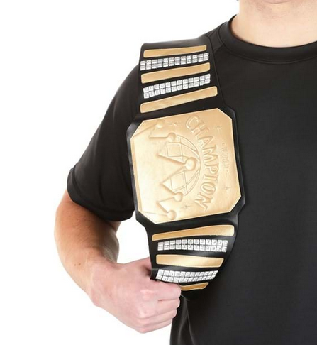 Crafted from 100% polyester faux leather, this belt is designed with a large gold medal at the front of the belt and silver studs along the length of the belt, pictured here slung over the shoulder of a champion. 