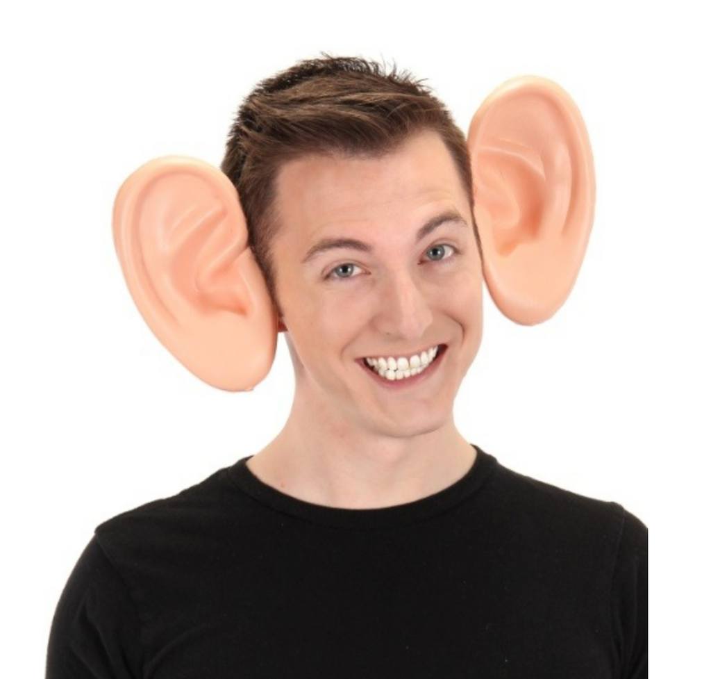 Oversized human ears are made of the lightest weight EVA foam and are secured to a low-profile black plastic headband. Shown here being worn by an adult. 