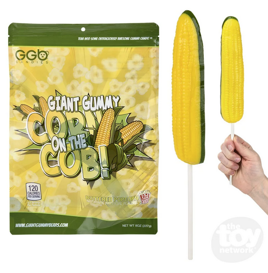 Gummy Corn on the cob on a stick. Yellow gummy kernels with green gummy husk on the back side.