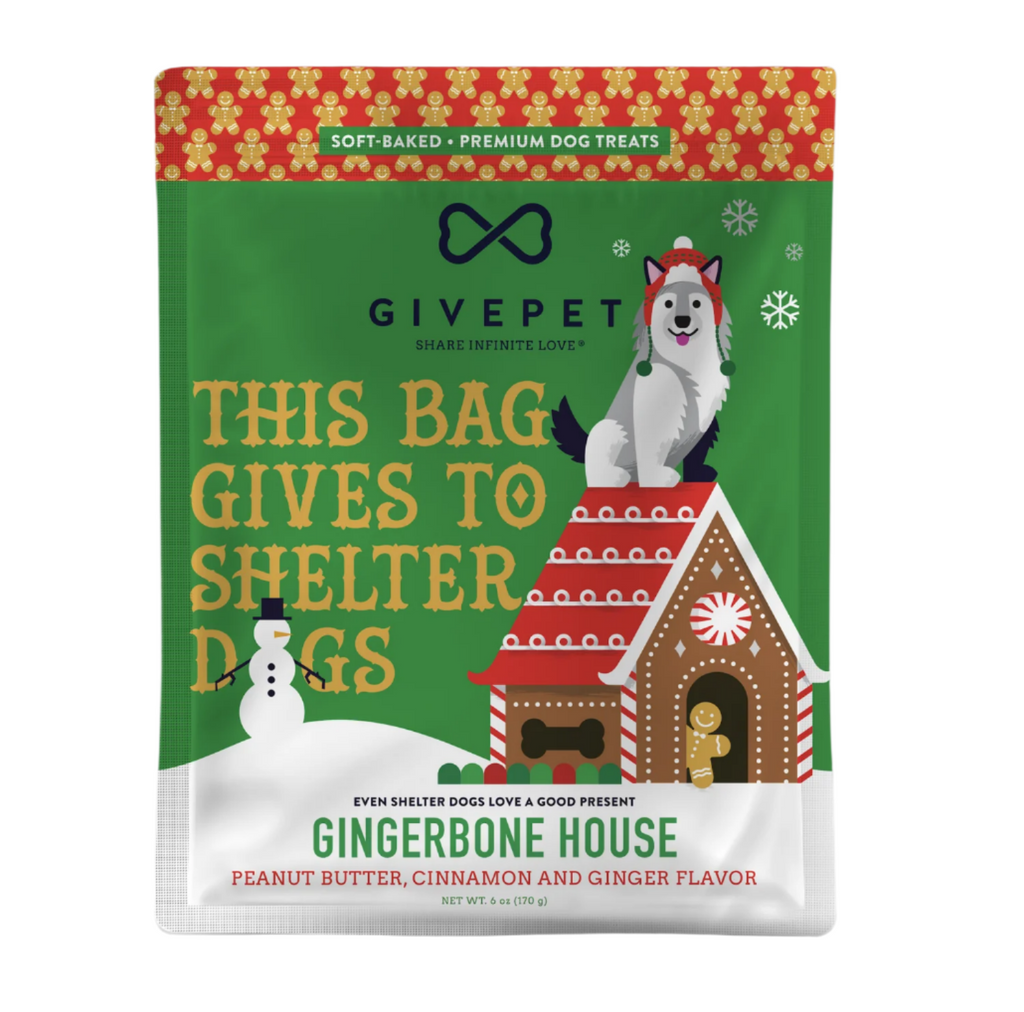 Dog treat bag with festive illustrations of a dog sitting on top of a gingerbread dog house. 