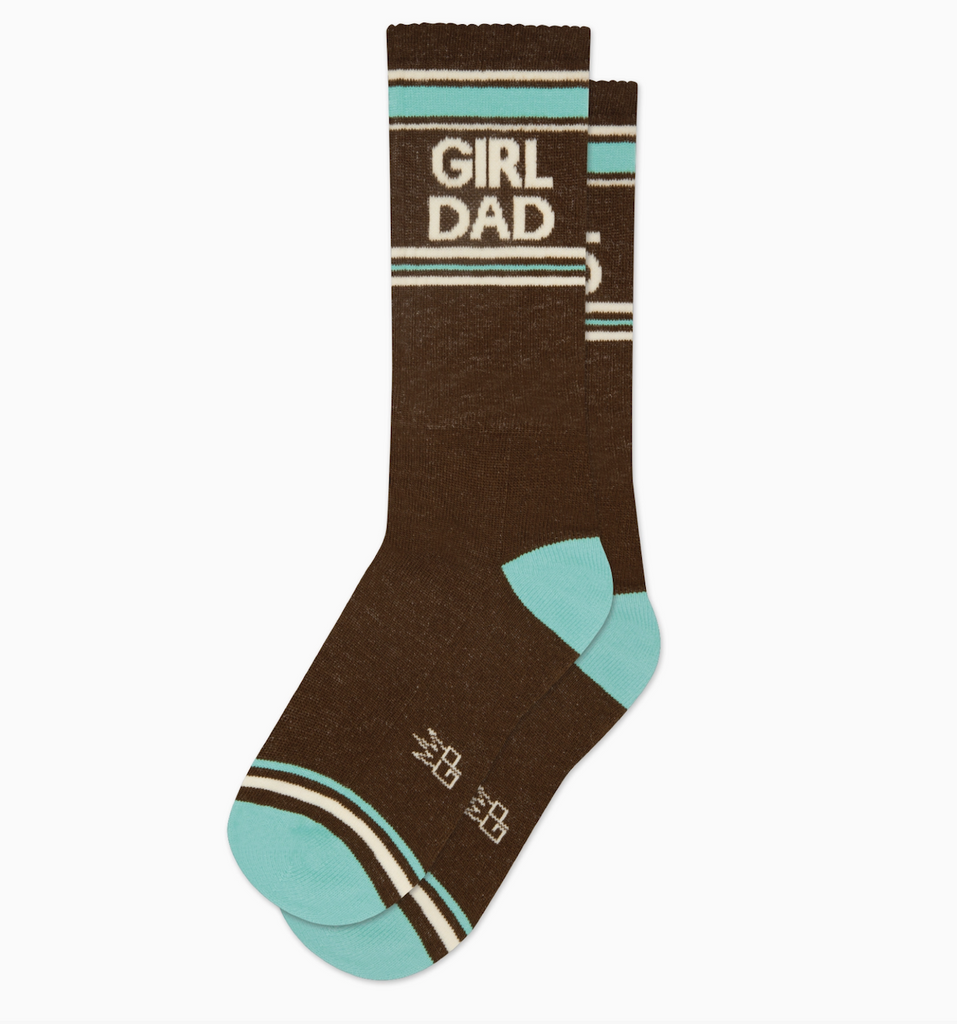 Crew socks that read "Girl Dad" in cream letters with brown and turquoise background. 