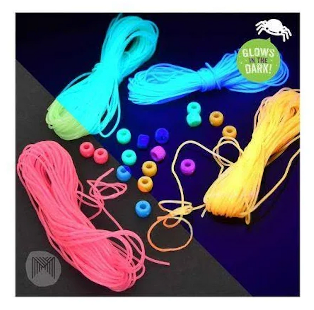 Threads and beads that are included in the Glow Jewelry Kit shown in regular light as well as under black light. 