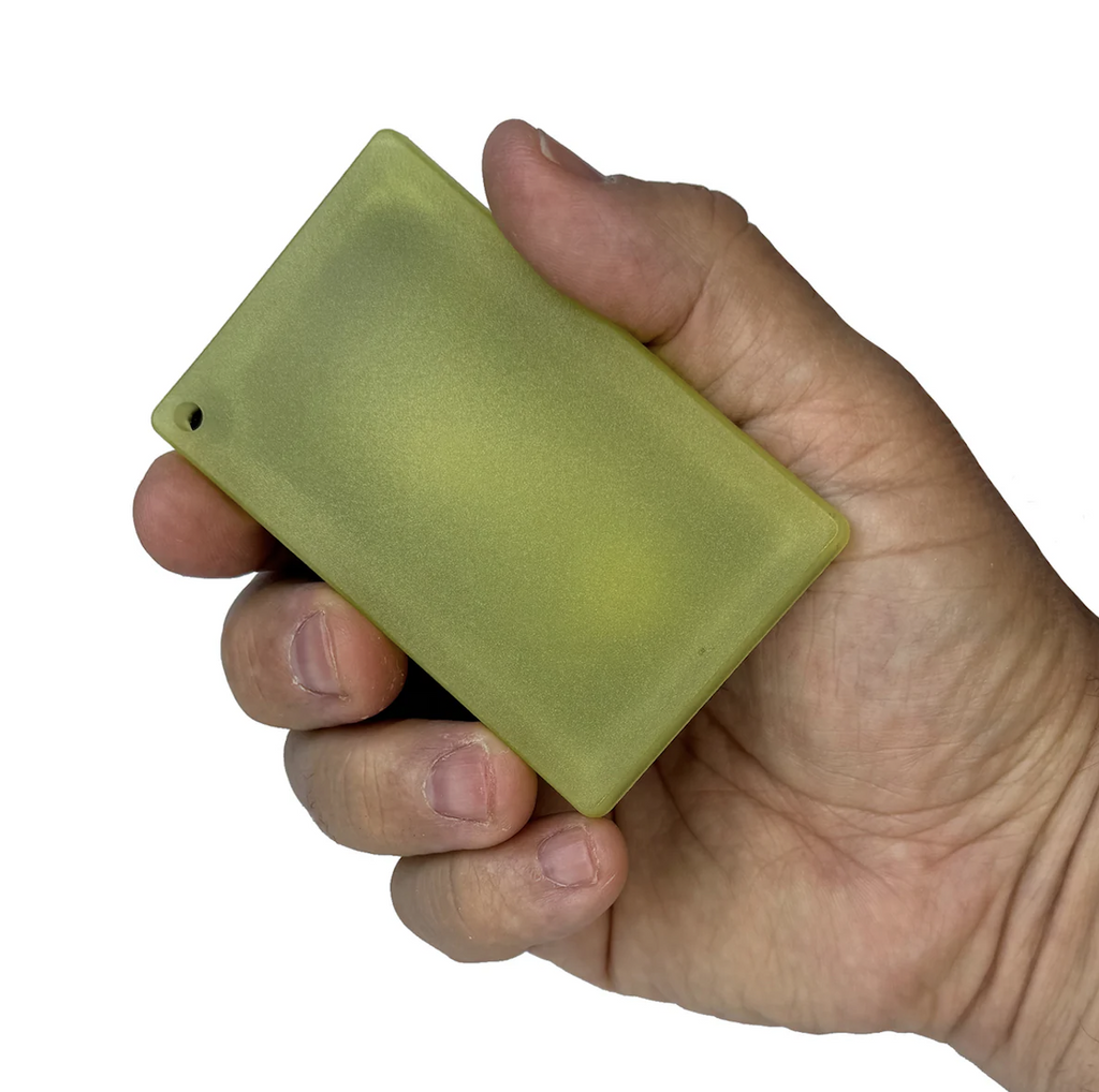 The Glow Grip Card, a credit card sized bar that glows in the dark and recharges with any light source. 