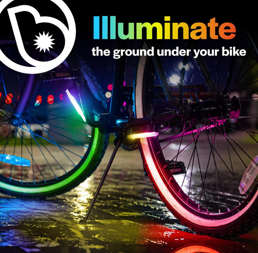 A bike with the Go Brightz Color Select lights attached that are illuminating the ground below. 