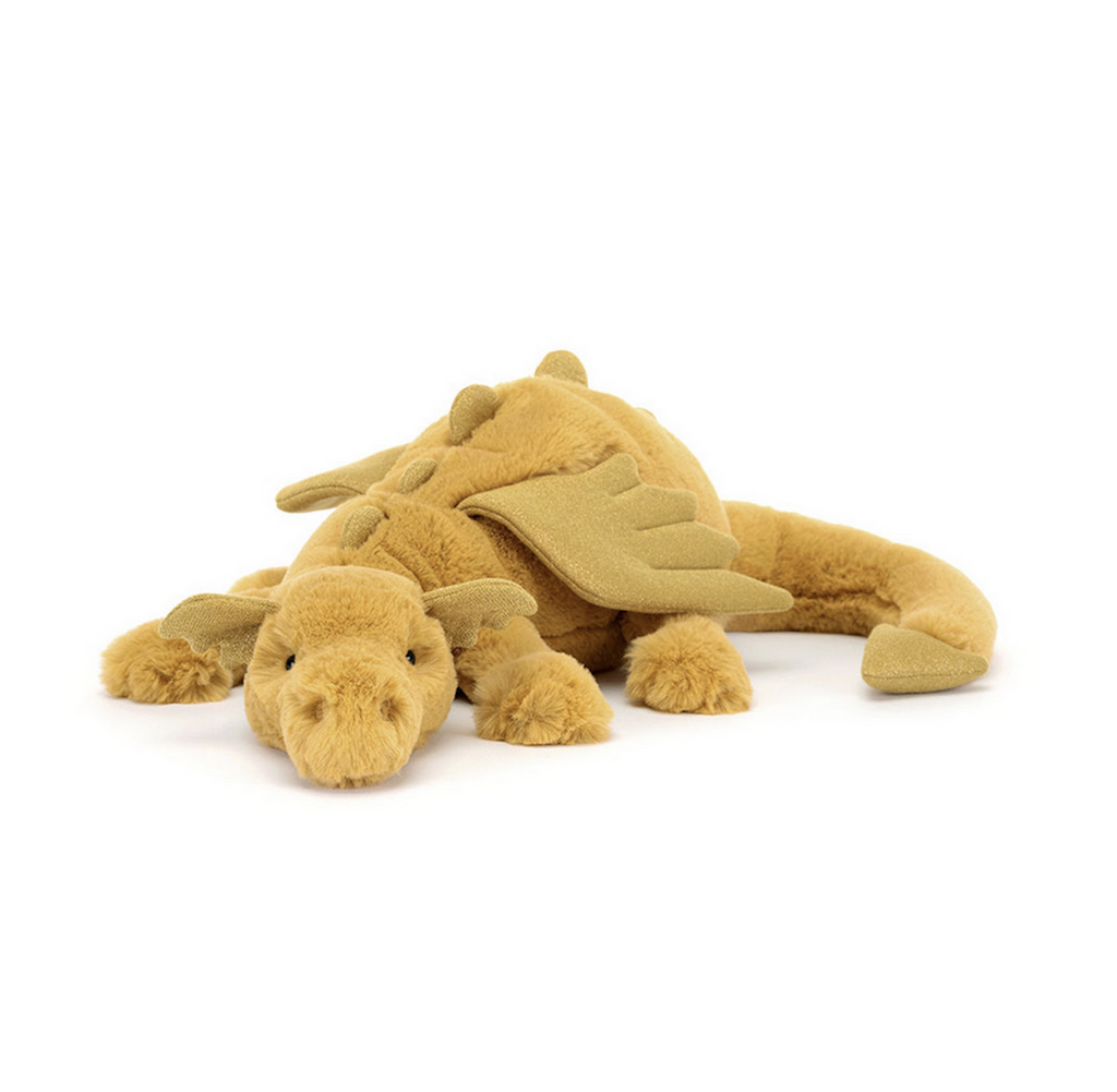 Golden Dragon stuffed animal lying down. 