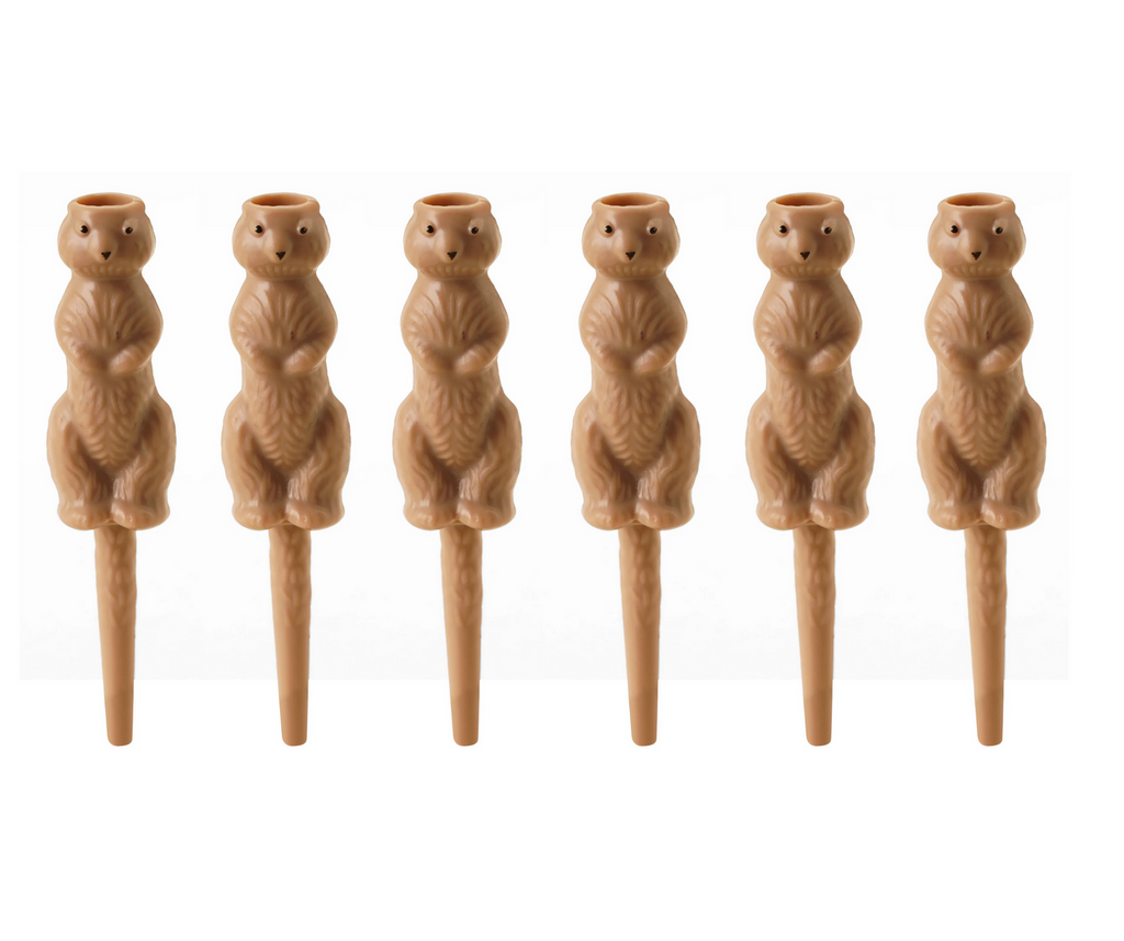 Six gopher shaped golf tees.