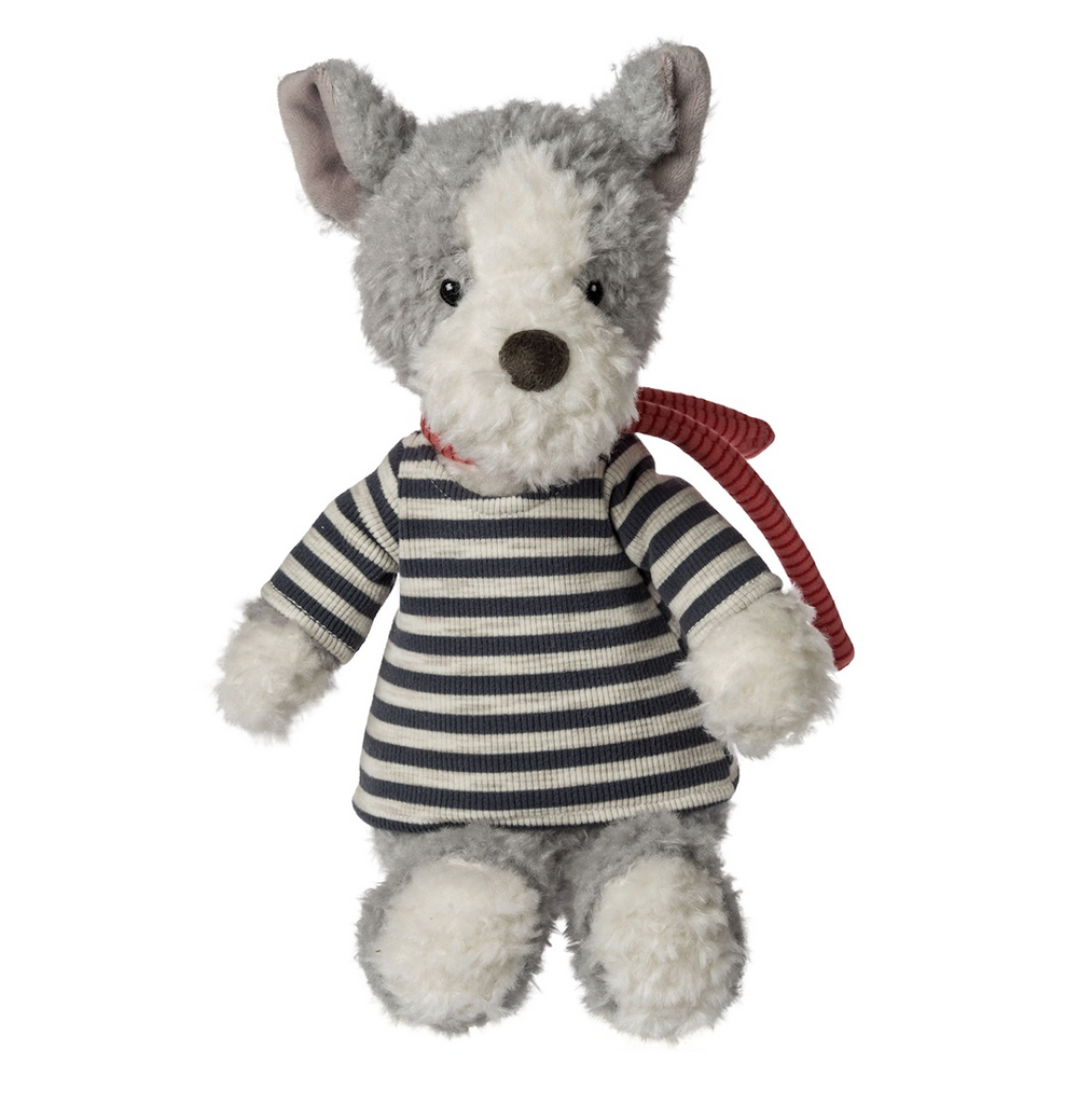 Grafton Tails is a plush dog with fuzzy grey and white fur. He's wearing a grey and black striped shirt with a red striped scarf. He is in a seated position and facing forward. 