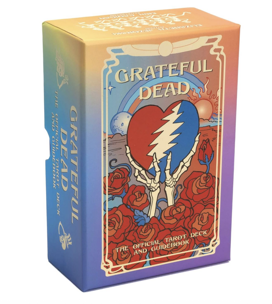 Grateful Dead Tarot deck packaged in a colorfully illustrated box with Grateful Dead inspired artwork featuring skeleton hands holding up a red and blue heart with a lighting bolt through the middle with roses surrounding it. 