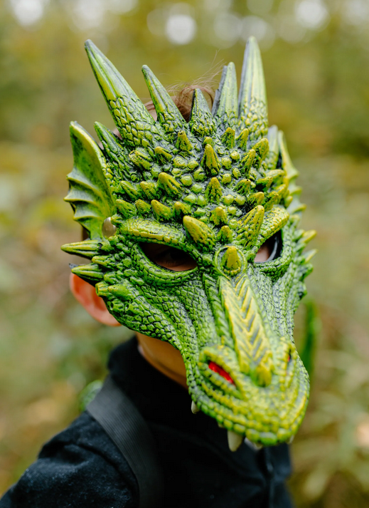 A young child is wearing the green dragon mask. Rubberized texture adds an extra layer of realism to the design of the green dragon mask. It looks like dragon's scales.