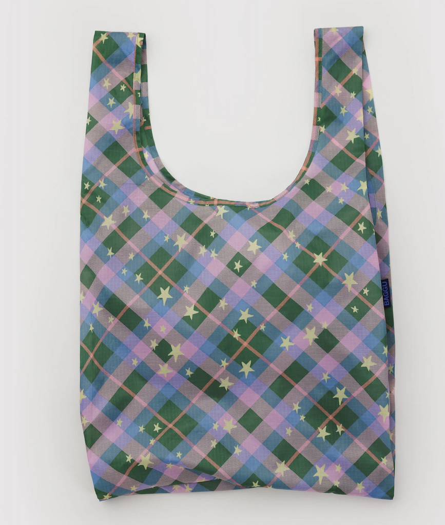 Standard Baggu reusable shopping bag with a green, purple and pink plaid pattern with gold stars. 