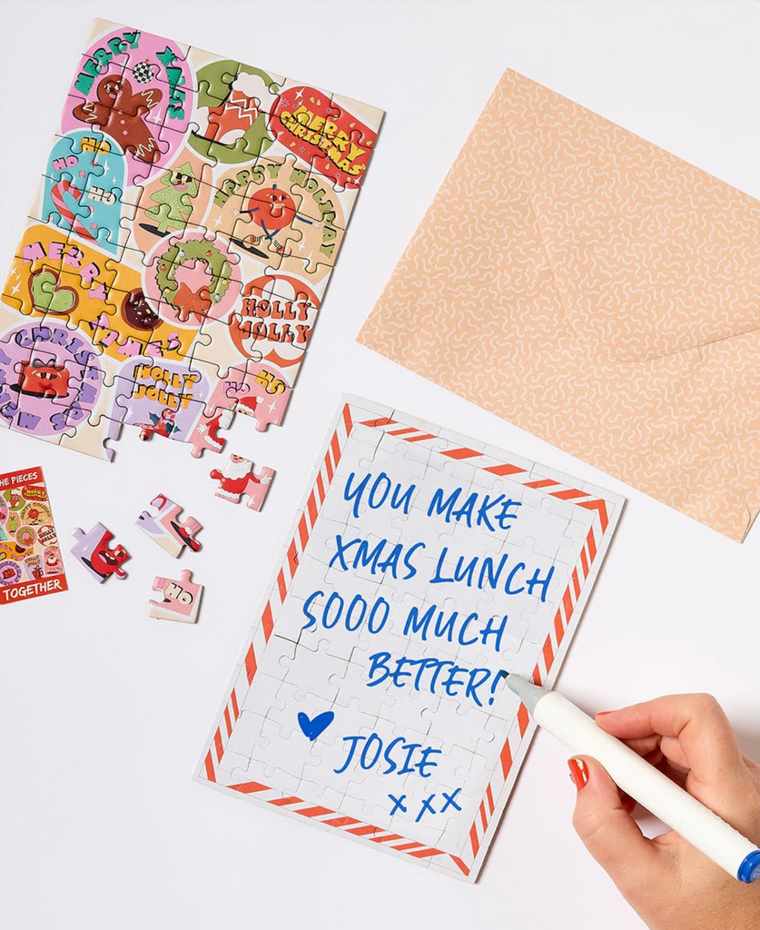 Christmas themed jigsaw puzzle card with handwritten note on the back  with decorative envelope. 
