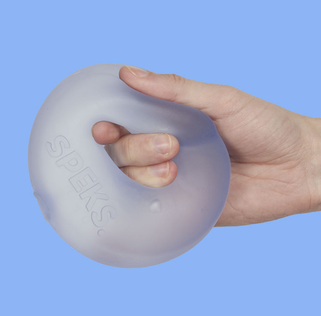 Close up of a hand holding the jumbo Gump Loop in Dew, which is a light blue color. 