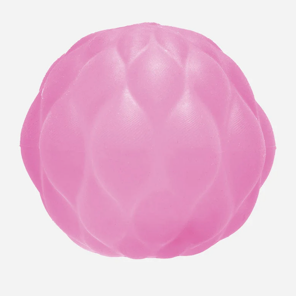 Close up of the Gump Surface Quilt stress ball in pink. 