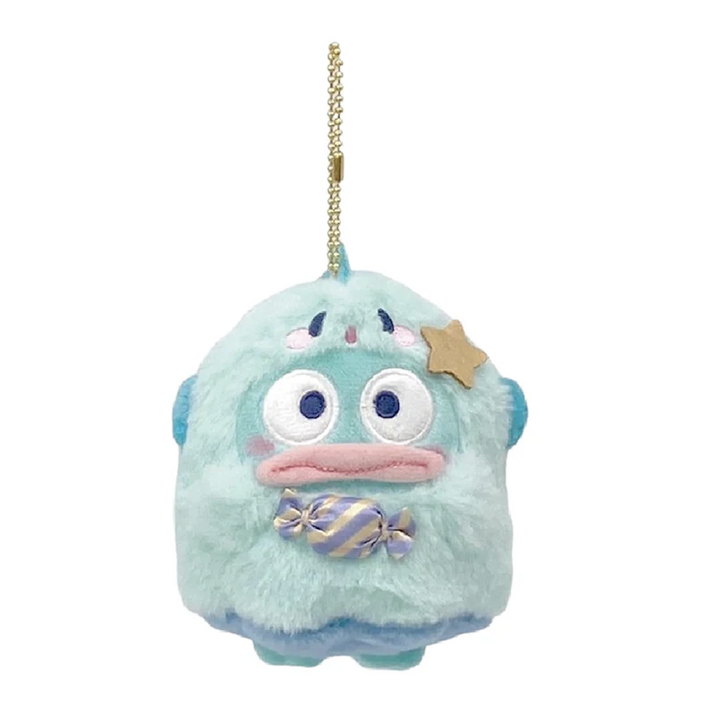 Hangyodon plush mascot dressed as a ghost, holding a piece of candy and hanging from a gold tone ball chain. 