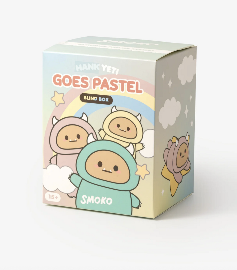 Blind box for the Hank Yeti Goes Pastel plush Bag Charm. The box is illustrated with depictions of the Hank Yeti in pastel colors. 