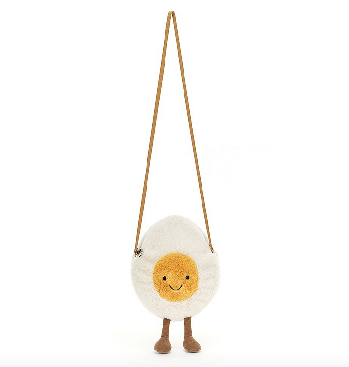 Happy Boiled Egg Bag is one chipper champ! Smiley and sunny, with a strong mustard strap, soft white fur and a gorgeous golden yolk, this egg likes to dangle those scrummy cord boots.
