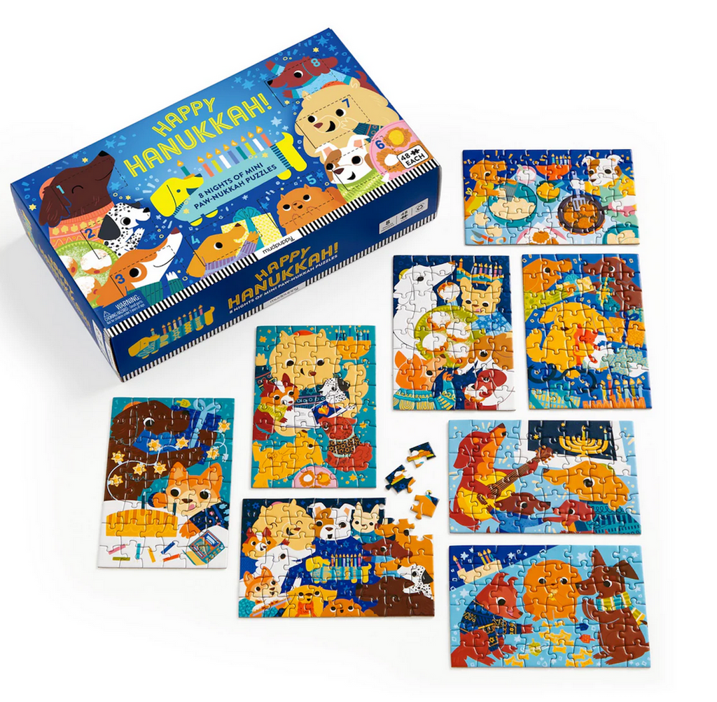 Set of Hanukkah-themed children's puzzles with a colorful box illustrated with a menorah and dogs wearing sweaters and holding presents. 
