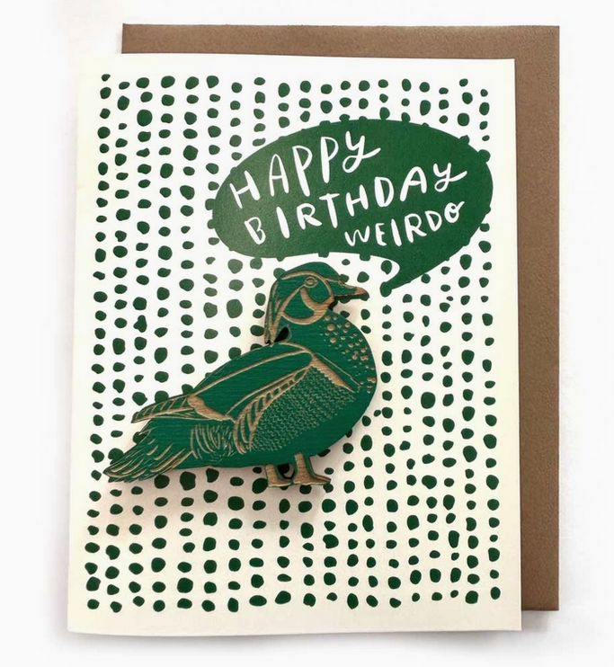 White greeting card with dark green dots in a repeating pattern with a word bubble that reads "Happy Birthday Weirdo" and a removeable duck magnet.